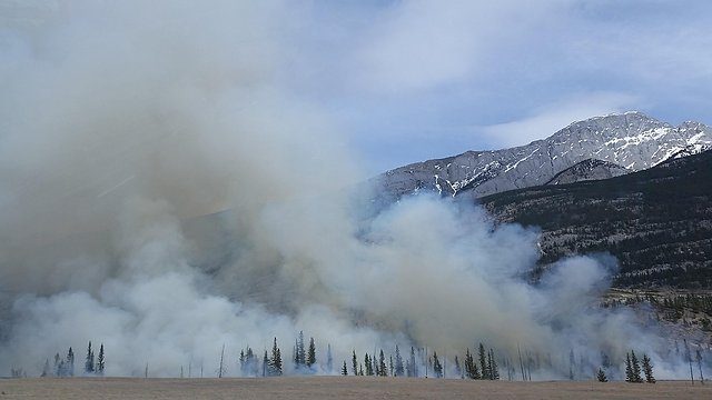 Wildfire smoke over mountains