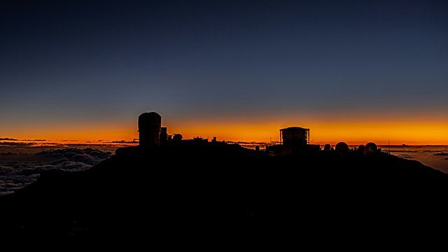 Observatory domes sunset clouds