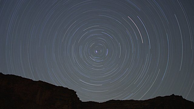 Star trails canyon silhouette