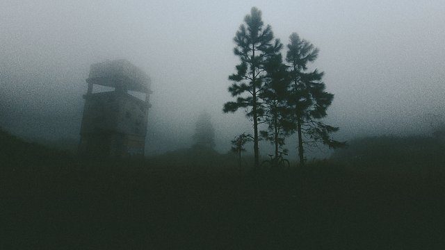 Foggy watchtower silhouette