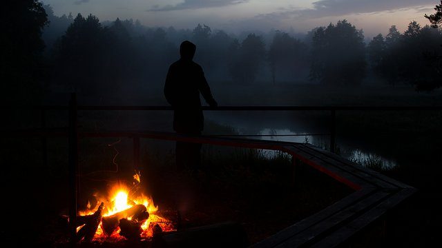 Campfire silhouette fog
